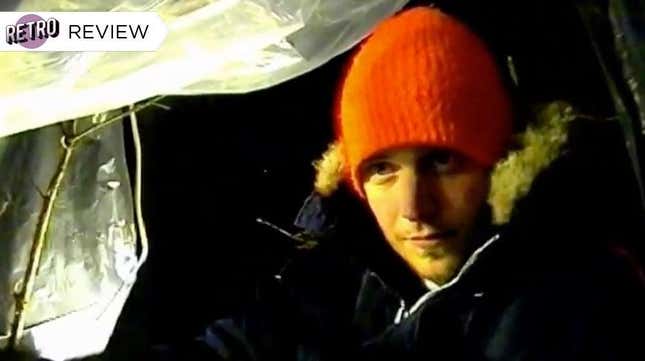 A man in an orange hat in grainy video footage