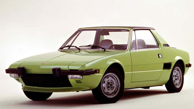 A photo of a green Fiat X1/9 sports car. 