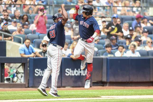 Aug 19, 2023; Bronx, New York, USA;  Boston Red Sox second baseman Luis Urias (17) celebrates with third base coach Carlos Febles after hitting. A home run in the second inning against the New York Yankees at Yankee Stadium.