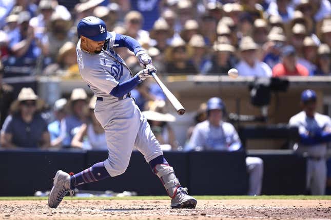 Aug 7, 2023; San Diego, California, USA; Los Angeles Dodgers second baseman Mookie Betts (50) hits a grand slam home run during the fourth inning against the San Diego Padres at Petco Park.