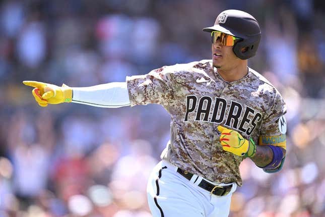 Jul 9, 2023; San Diego, California, USA; San Diego Padres third baseman Manny Machado (13) gestures toward the Padres dugout after hitting a two-run home run against the New York Mets during the fifth inning at Petco Park.