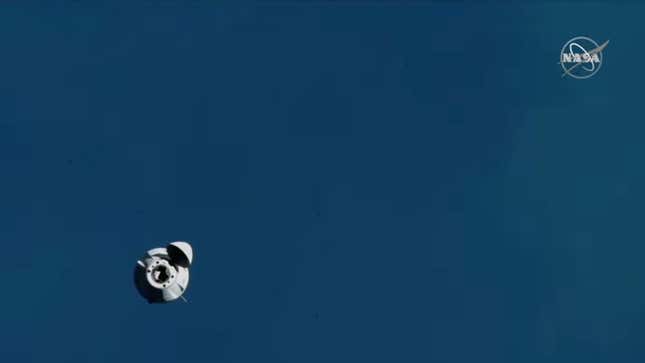 The Dragon capsule approaching the ISS.