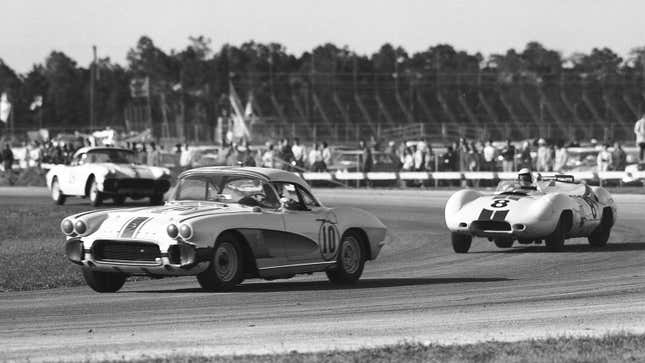 A black and white photo of a Corvette in a race. 