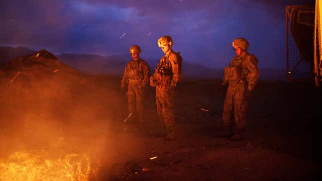 U.S. soldiers burn trash in a pit outside a base in Jaghatu, Afghanistan, in 2012. Military burn pits have been linked to cancers and other diseases among veterans.