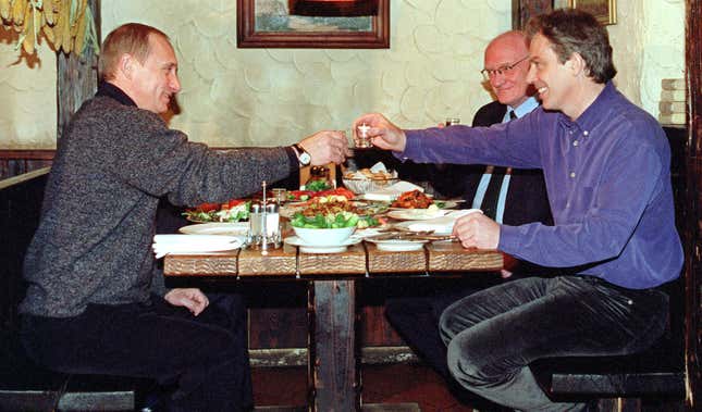 Putin and British prime minister Tony Blair share a vodka toast in 2000.