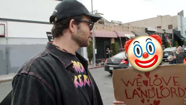 Hasan "Hasanabi" Piker is staring at Matan Even, who's holding up a "We love landlords" sign at a WGA picket line.