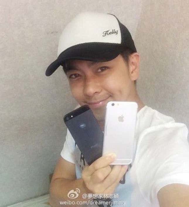 Ex-Taiwanese pop star Jimmy Lin poses with what he says is the iPhone 6.