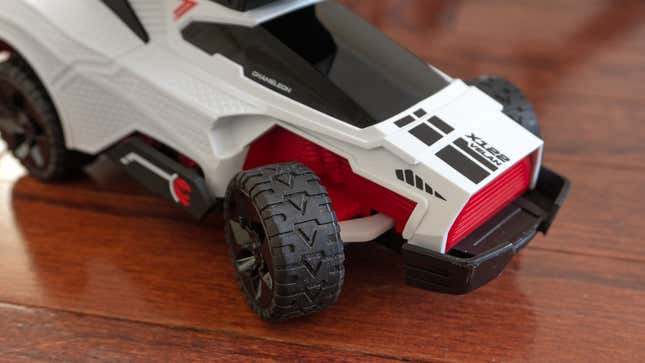 A close up of the Hot Wheels: Rift Rally's RC Chameleon car's front right wheel.