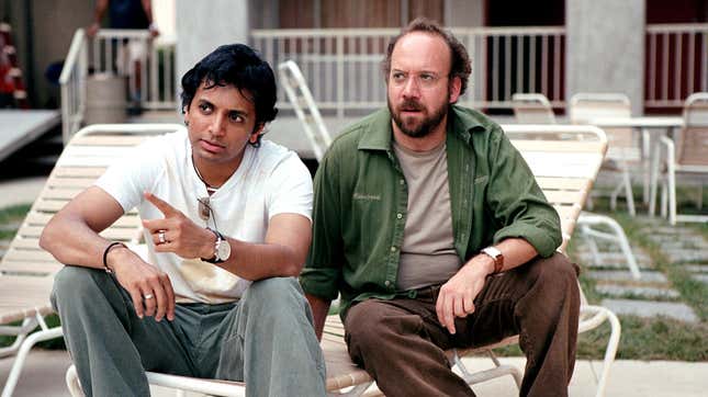 M. Night Shyamalan (left) played a character of grave importance in his own movie.