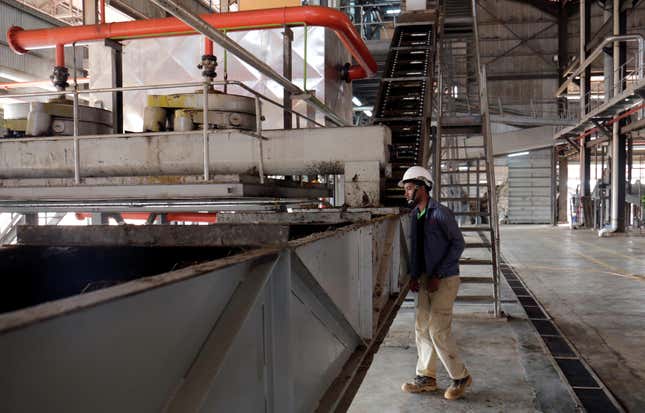 A worker stands inside a palm oil factory in Bomi County, Liberia December 30, 2017. Picture taken December 30, 2017.