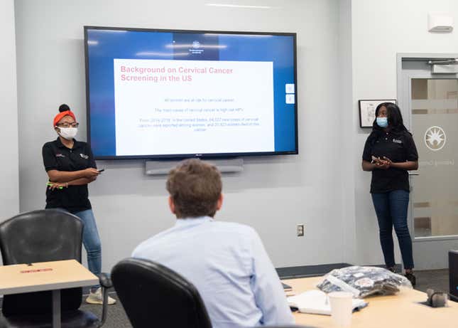 UMB CURE Scholars, Ayishat Yussuf and Markia Eubanks present research on cervical cancer during an internship at Becton Dickinson. 