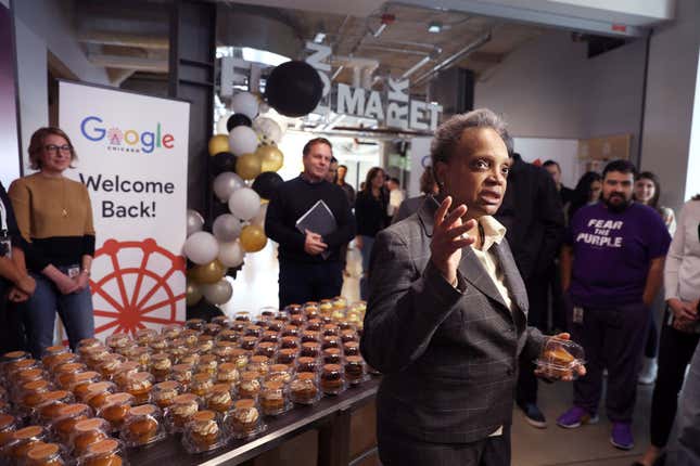 Chicago Mayor Lori Lightfoot greets employees returning to work at the Chicago Google offices on April 05, 2022, in Chicago, Illinois. Google employees began returning to work in the office this week for three days a week following a two-year hiatus caused by the COVID-19 pandemic. 