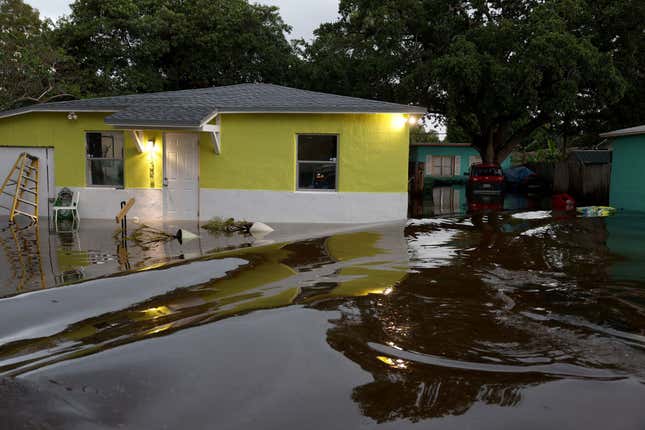 Flood waters surround a home on April 13, 2023 in Fort Lauderdale, Florida.