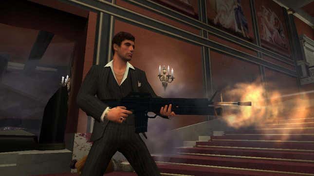 Tony Montana, as seen in the game, shooting a large assault rifle at off screen bad guys.