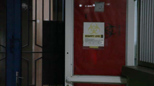 The room adjacent to the BSL3 laboratory. Yaya has just entered to put on his blue jumpsuit.