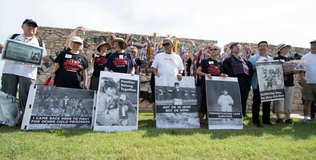 FORT SILL, OK - JUNE 22: Agroup of Japanese Americans who held in concentration camps in WWII pose with photos of themselves, during a press conference on June 22, 2019 i