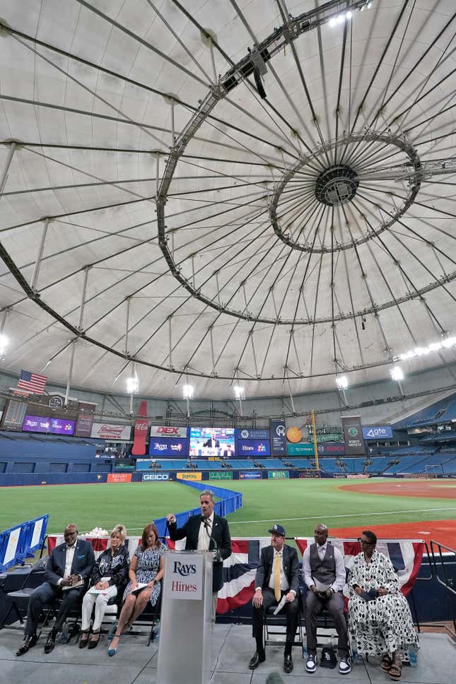 Tampa Bay Rays owner Stuart Sternberg, center, behind podium, speaks to invited guests and members of the media at Tropicana Field as the baseball team announced plans for a new stadium during a news conference Tuesday, Sept. 19, 2023, in St. Petersburg, Fla. (AP Photo/Chris O&#39;Meara)