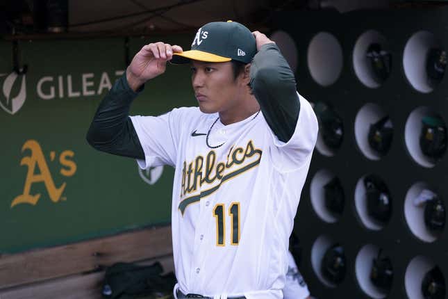 March 30, 2023; Oakland, California, USA; Oakland Athletics starting pitcher Shintaro Fujinami (11) stands in the dugout before the game against the Los Angeles Angels at RingCentral Coliseum.