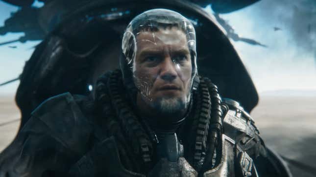 General Zod, wearing his transparent helmet, stands aboard his ship.