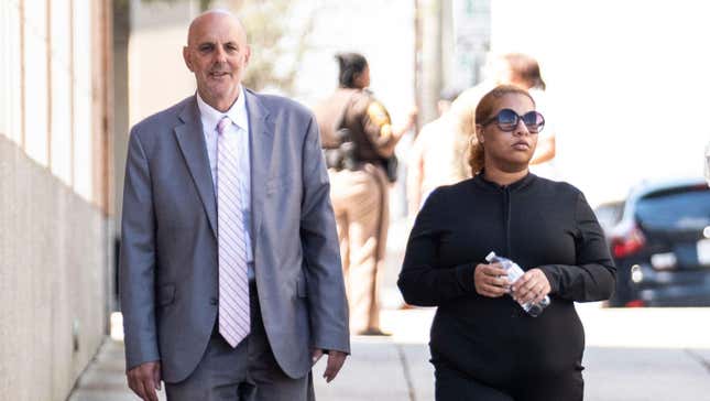 Deja Taylor arrives with attorney James Ellenson, left, to the Newport News Sheriffs Office in Newport News, Virginia, on April 13, 2023, to turn herself in. Taylor is the mother of the 6-year-old first grader who shot his teacher at Richneck Elementary School on Jan. 6. Taylor was charged with felony child neglect and a misdemeanor count of recklessly leaving a firearm so as to endanger a child. (Billy Schuerman/Daily Press /Tribune News Service via Getty Images)