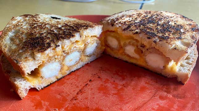 Grilled cheese with mozzarella sticks in it.