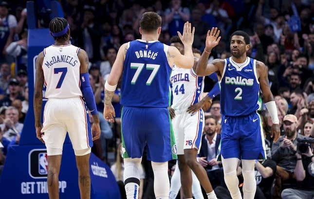 Mar 2, 2023; Dallas, Texas, USA;  Dallas Mavericks guard Kyrie Irving (2) celebrates with Dallas Mavericks guard Luka Doncic (77) during the second half against the Philadelphia 76ers at American Airlines Center.