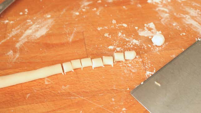 A rope of tapioca dough cut into small segments.