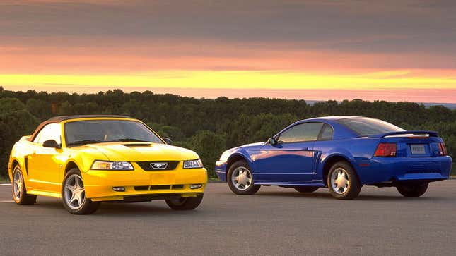 A photo of two MKIV Ford Mustang muscle cars. 