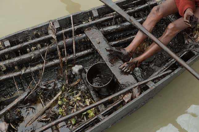 Local fishermen and their families from the villages near the spill site work in the muck without any protective gear.