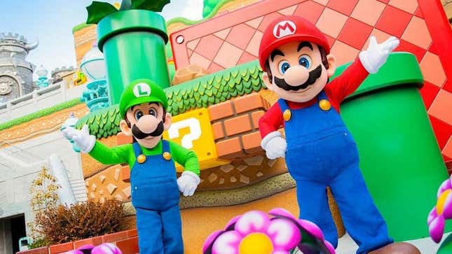 Mario and Luigi greet fans at the opening of Nintendo's Japan theme park. 
