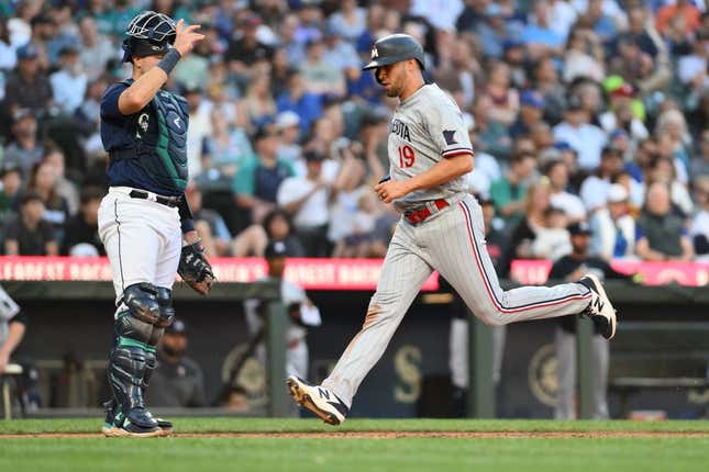 Jul 18, 2023; Seattle, Washington, USA; Minnesota Twins first baseman Alex Kirilloff (19) scores a run off a double hit by right fielder Max Kepler (26) (not pictured) during the fourth inning against the Seattle Mariners at T-Mobile Park.