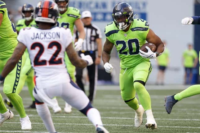 Sep 12, 2022; Seattle, Washington, USA; Seattle Seahawks running back Rashaad Penny (20) rushes against the Denver Broncos during the first quarter at Lumen Field.
