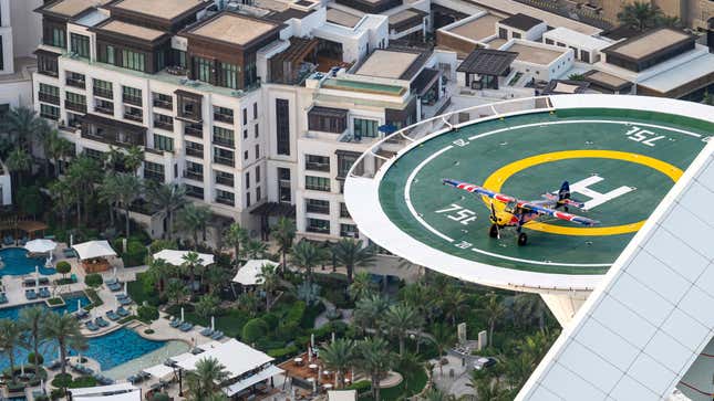 Image for article titled Stunt Pilot Lands Airplane on the World&#39;s Shortest Runway, a Helipad