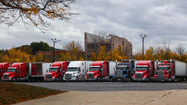 A photo of a row of commercial trucks parked in Chicago. 