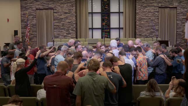 A group of anti-abortion Operation Save America members gather in prayer.