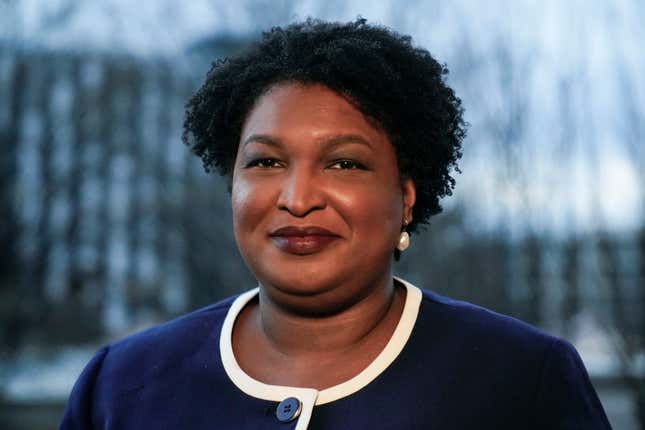Georgia gubernatorial Democratic candidate Stacey Abrams poses for a photo during an interview with The Associated Press on Dec. 16, 2021, in Decatur, Ga. Abrams was missing Tuesday when President Joe Biden swung through the city to press for voting rights protections. During a day that was shrouded in the city’s legacy as the cradle of the Civil Rights Movement, the absence of one of the nation’s most prominent voting rights activists sparked something of an awkward moment.