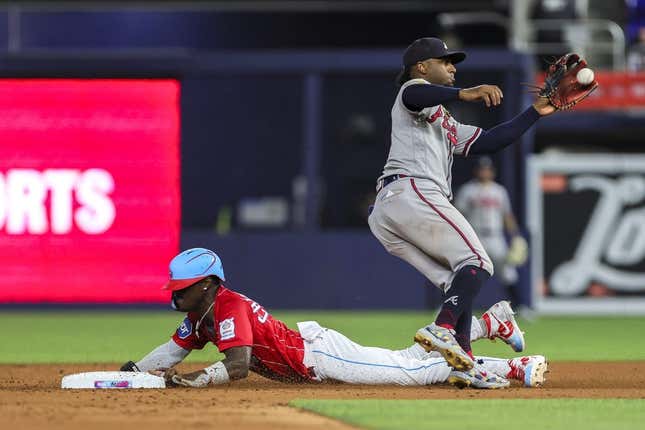 Sep 16, 2023; Miami, Florida, USA; Miami Marlins center fielder Jazz Chisholm Jr. (2) steals second base against Atlanta Braves second baseman Ozzie Albies (1) during the fifth inning at loanDepot Park.