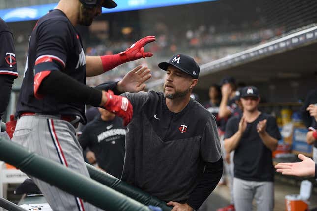 Aug 9, 2023; Detroit, Michigan, USA;  Minnesota Twins first baseman Joey Gallo (13) is congratulated on the dug out steps by manager Rocco Baldelli (5) after hitting a two run home run off Detroit Tigers starting pitcher Alex Faedo (49) (not pictured)  in the second inning at Comerica Park.