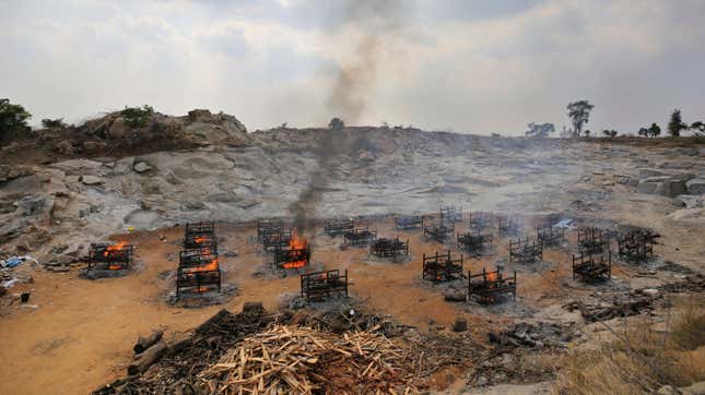 Funeral pyres for 25 separate people burn at a granite quarry near Bengaluru, India, in May 2021.