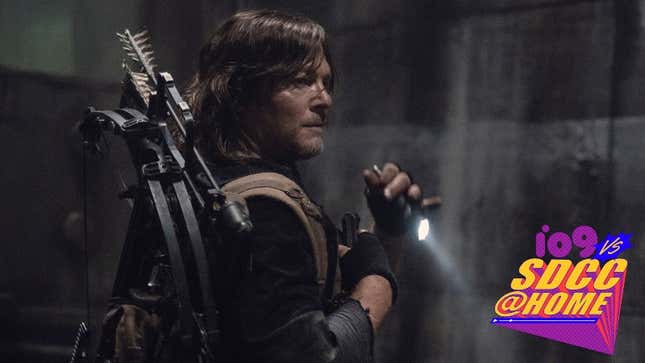 The Walking Dead's Daryl (Norman Reedus) wears his crossbow gear on  his back and holds a flashlight in his hands in a dark room/ 