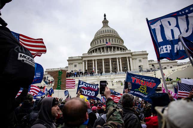 Pro-Trump supporters storm the U.S. Capitol following a rally with President Donald Trump on January 6, 2021 in Washington, DC. Trump supporters gathered in the nation’s capital today to protest the ratification of President-elect Joe Biden’s Electoral College victory over President Trump in the 2020 election. 