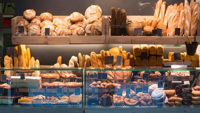 Baguettes, rolls, pastries, bread behind counter