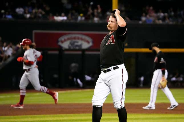 Jul 24, 2023; Phoenix, AZ, USA; Arizona Diamondbacks relief pitcher Andrew Chafin (57) reacts after walking in the winning run against the St. Louis Cardinals in the ninth inning at Chase Field.