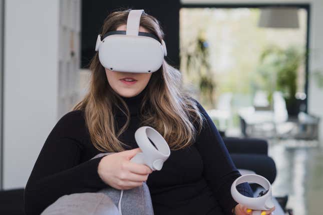 Photo of a person wearing Oculus Quest 2 headset