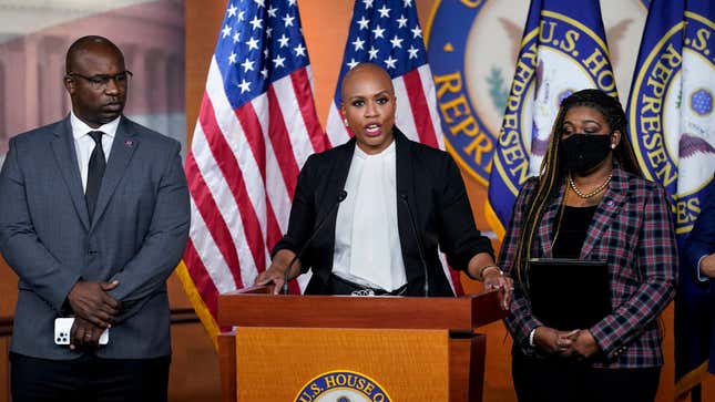 Rep. Ayanna Pressley, D-Mass., flanked by Rep. Jamaal Bowman, D-N.Y., left, and Rep. Cori Bush, D-Mo., tells reporters she is introducing a resolution to strip Rep. Lauren Boebert, R-Colo., of her committee assignments for repeatedly making anti-Muslim remarks aimed at Rep. Ilhan Omar, D-Minn., at the Capitol in Washington, Wednesday, Dec. 8, 2021. 