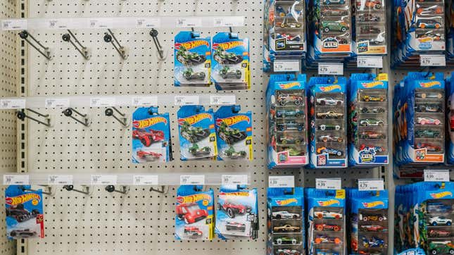 Image of a Target aisle taken in October 2021 with empty pegs that would normally stock Hot Wheels toy cars.
