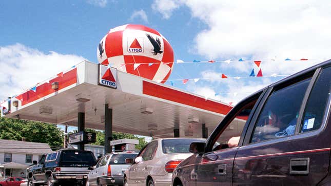 A photo of a Citgo where dozens of cars are lined up at the pump.