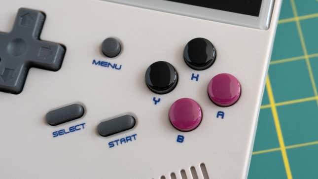 A close-up of the Anbernic RG35XX's action button controls.