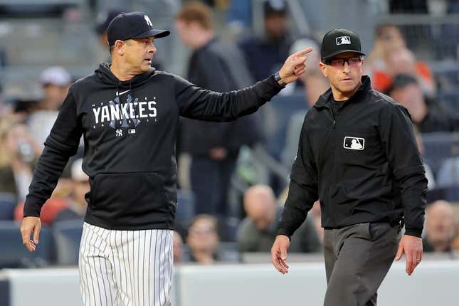 May 25, 2023;  Bronx, New York, USA;  New York Yankees coach Aaron Boone (17 years old) argues with first referee Chris Guccione (68 years old) during the third round against the Baltimore Orioles at Yankee Stadium.