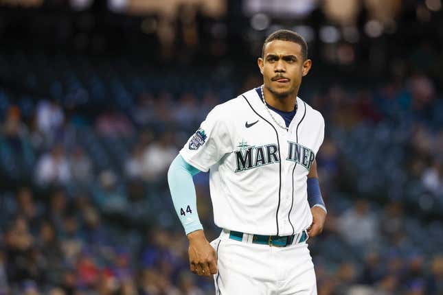 May 9, 2023; Seattle, Washington, USA; Seattle Mariners center fielder Julio Rodriguez (44) waits for his glove and hat from a teammate after striking out to end the seventh inning against the Texas Rangers at T-Mobile Park.